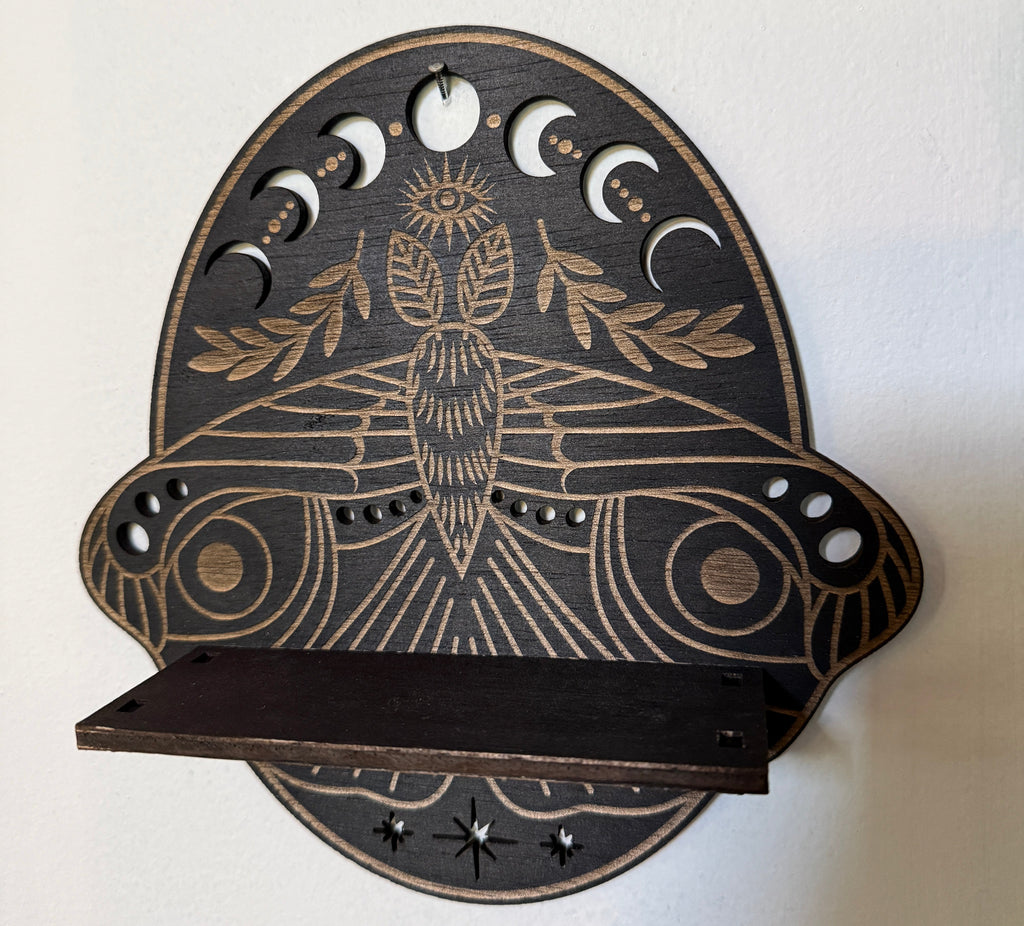 Crystal Decorative wall shelf with celestial design on a white background